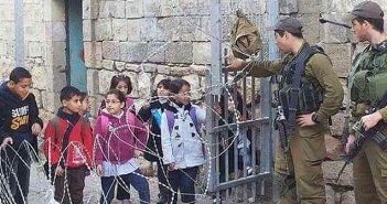Palestinian school chidldren at checkpoint
