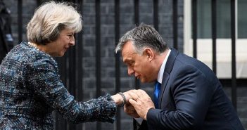Victor Orban kisses Theresa May